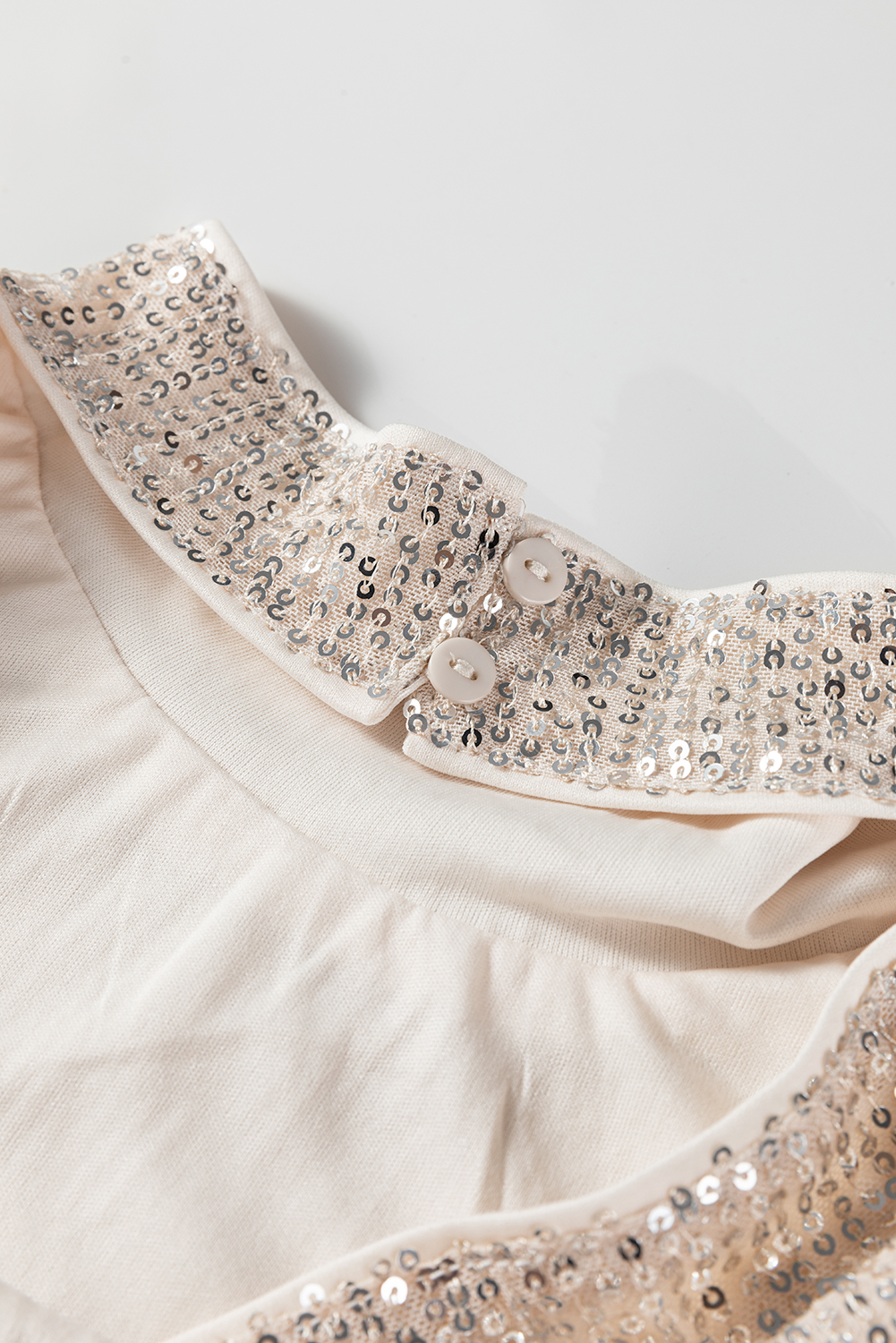 Jet Stream Sequin Mock Neck Drape Open Back Bell Sleeve Top